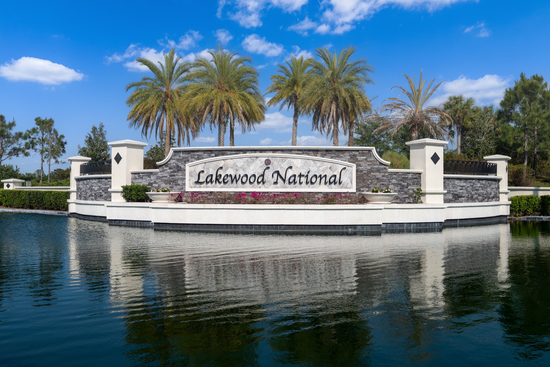 Lakewood National Golf Club entrance sign reflected on the front lake